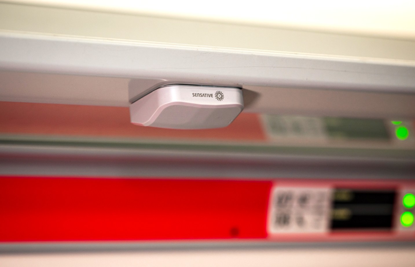 SeatSense by Sensative installed above a passenger seat in a train carriage